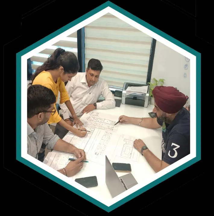 Team reviewing plans, pictured in the company portfolio